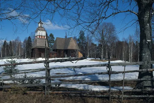 The Petäjävesi Old Church and a fence encircling its perimeter