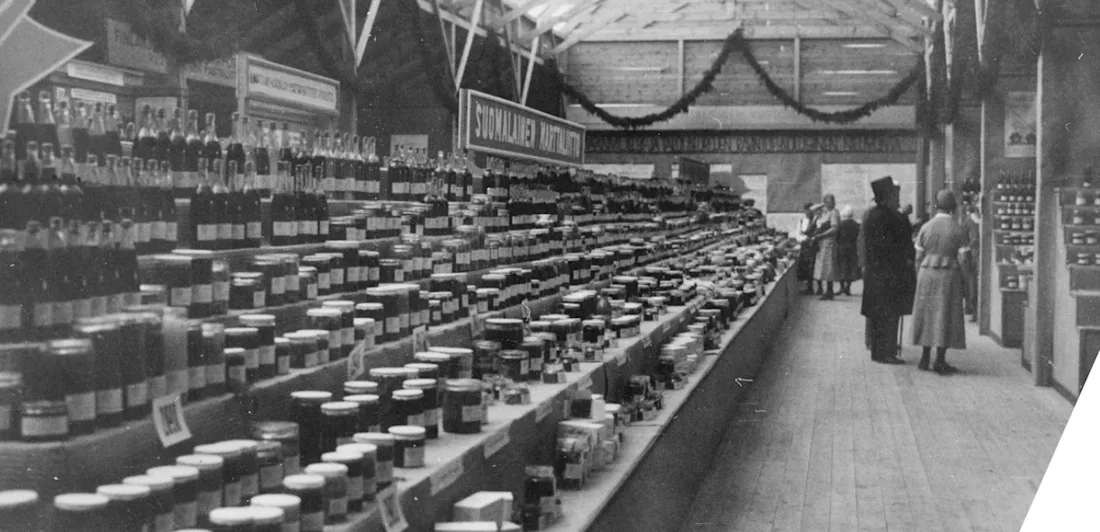Photograph of an exhibition with multiple jars on shelves