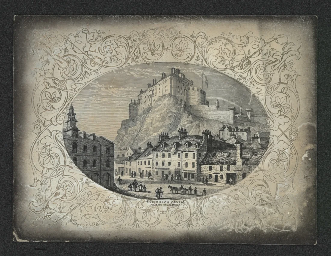 black and white image of Edinburgh Castle, it is seen on a hill with city streets in the foreground, the main image is oval surrounded by patterned decorative elements
