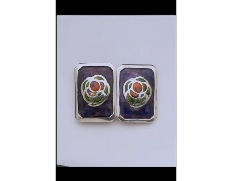 two buckles with stylised flower decoration