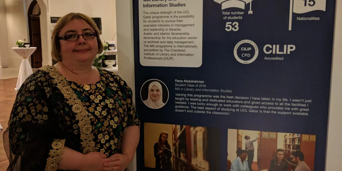 Milena Dobreva presenting MA Library and Information studies at UCL Qatar, which is on a presentation board.