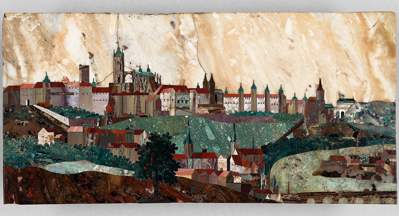 A piece of art made up of an assembly of stones representing a view of Prague Castle. 