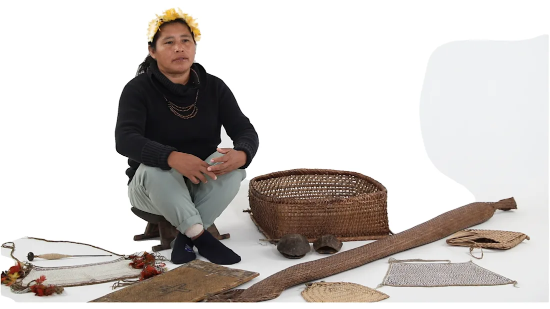 A person seated next to Wai Wai objects