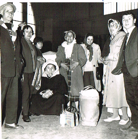 black and white photograph, standing group of people