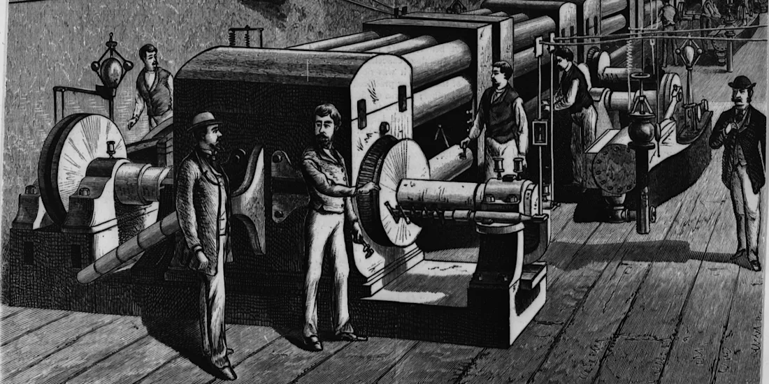 A black-and-white illustration of men operating large industrial machines in a factory.