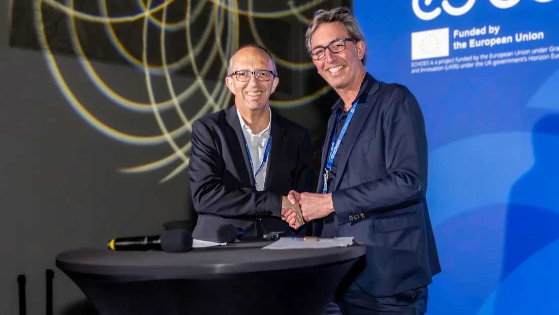 Harry Verwayen and Xavier Rodier shake hands after signing a joint statement.