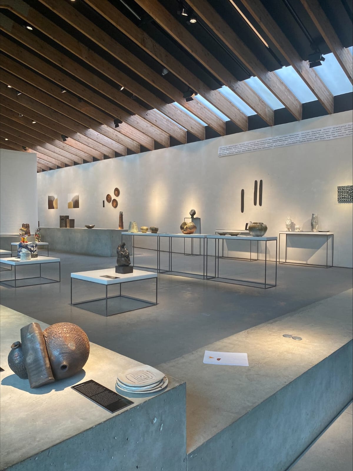 a photograph of the inside of a ceramics' centre, with several ceramic pieces on display.