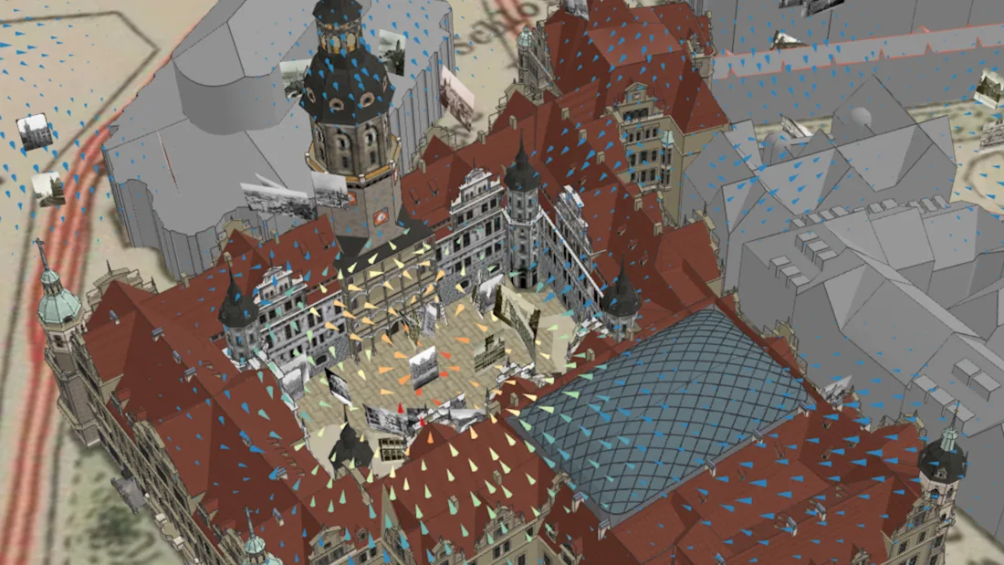 3D model of a historic building with wind flow arrows in blue and yellow overlaid on the structure.
