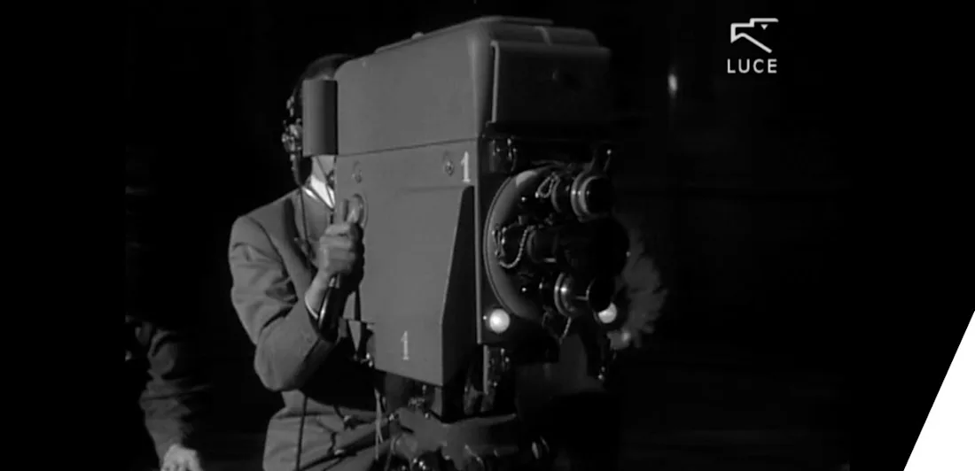 A person using an old-fashioned film camera