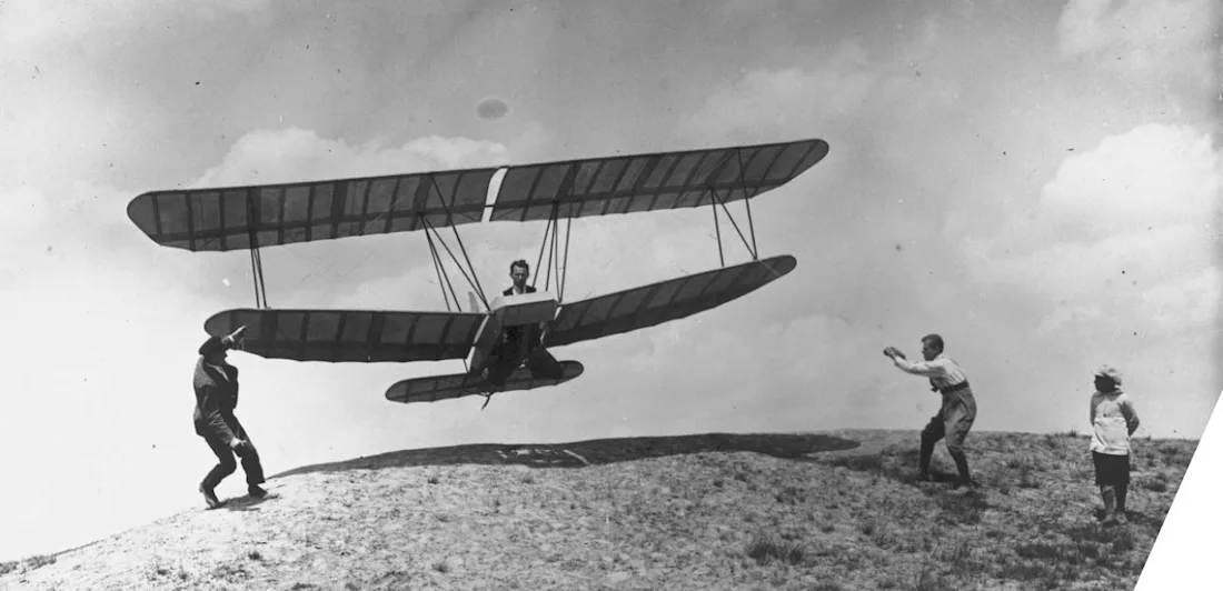 A handglider taking off