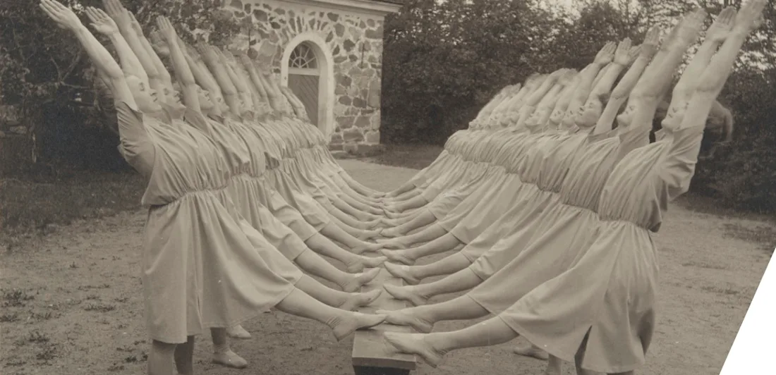A row of people raising their arms and legs in a gymnastic pose