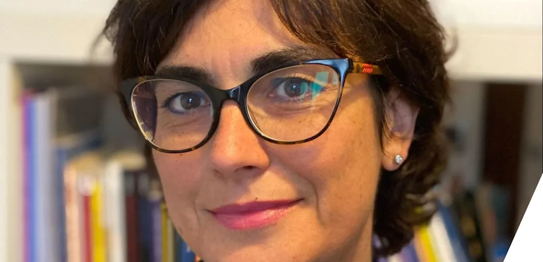 Headshot of Anna Maria Marras in front of a book case