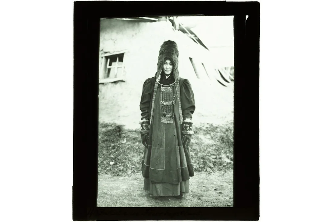 A photograph of Sakha (Yakut) woman in a traditional Sakha dress and accessories taken in 1908