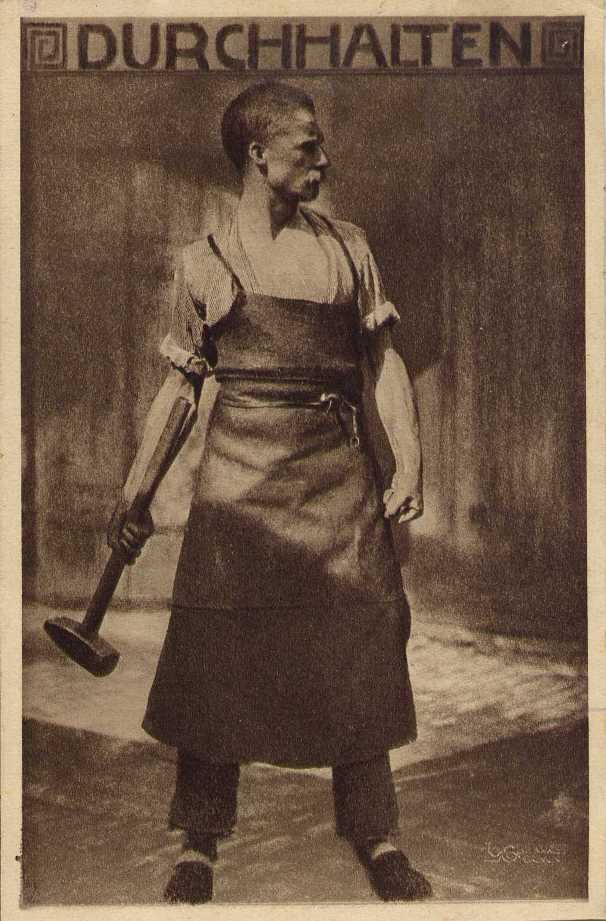 sepia photograph of a man wearing protective clothing holding a large hammer