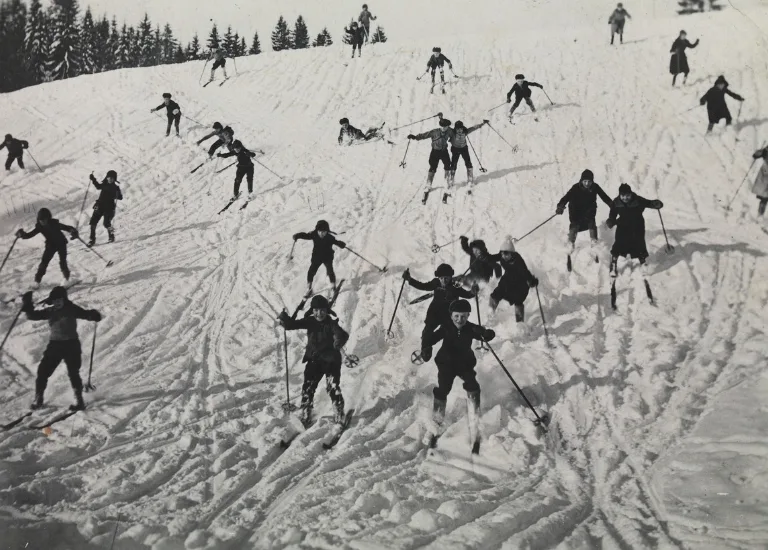 People skiing down a hill