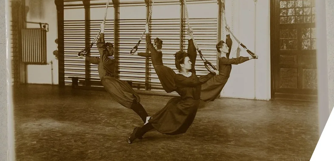 Four gymnasts using rings