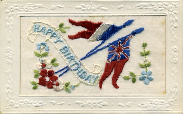 embroidered card with words Happy birthday and two flags