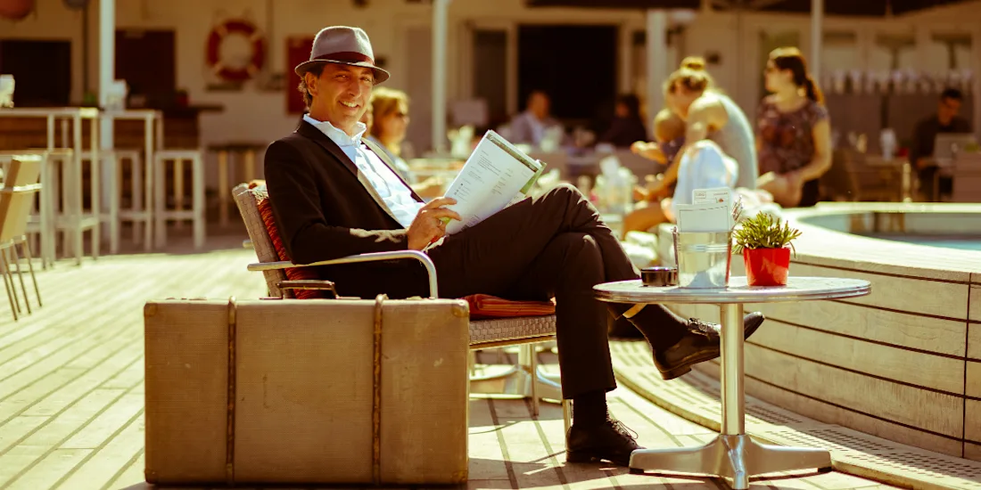Harry Verwayen sat on a chair on the deck of a ship