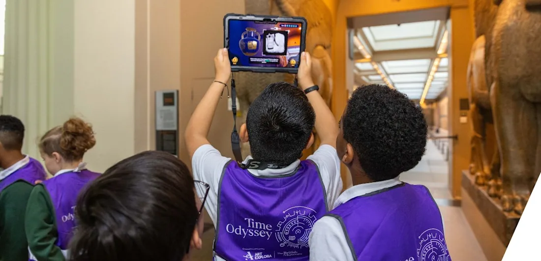 Children use a tablet with AR to explore ancient artifacts at the British Museum