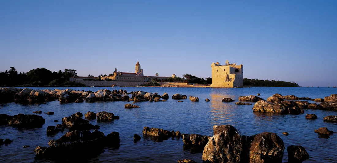 A coastal view of a monastery by the sea