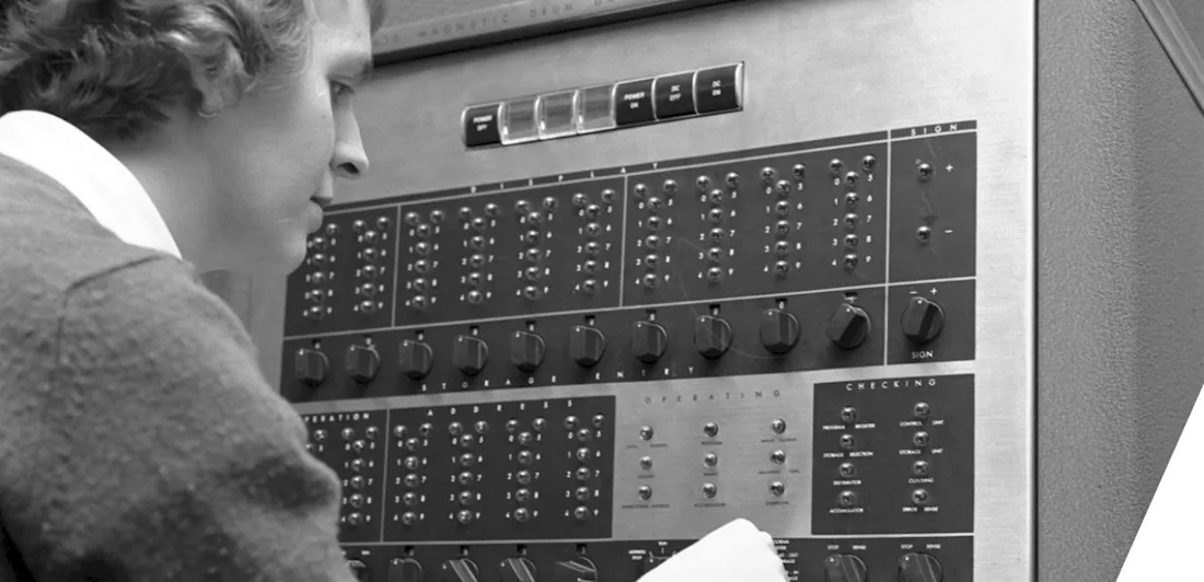 A woman working on a data processing machine
