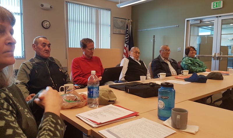 Alaskan Native experts sitting at a meeting table