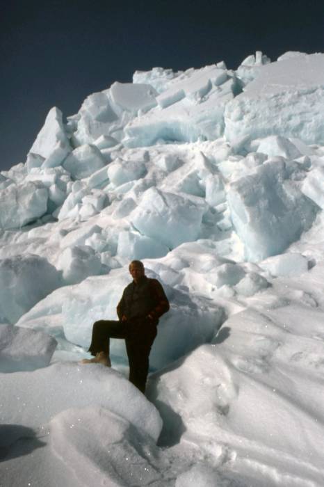 Steve Amstrup in front of a large pile of ice. 