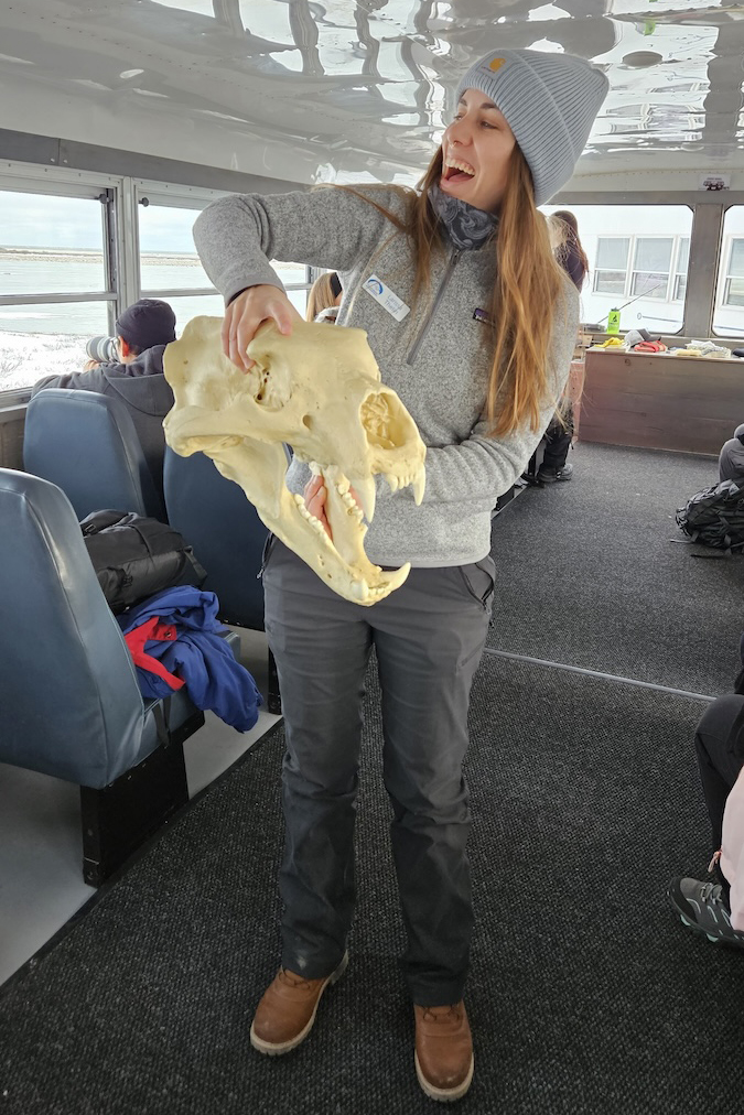 Field Ambassador Larissa Thelin on a Tundra Buggy with a Polar Bear Skull