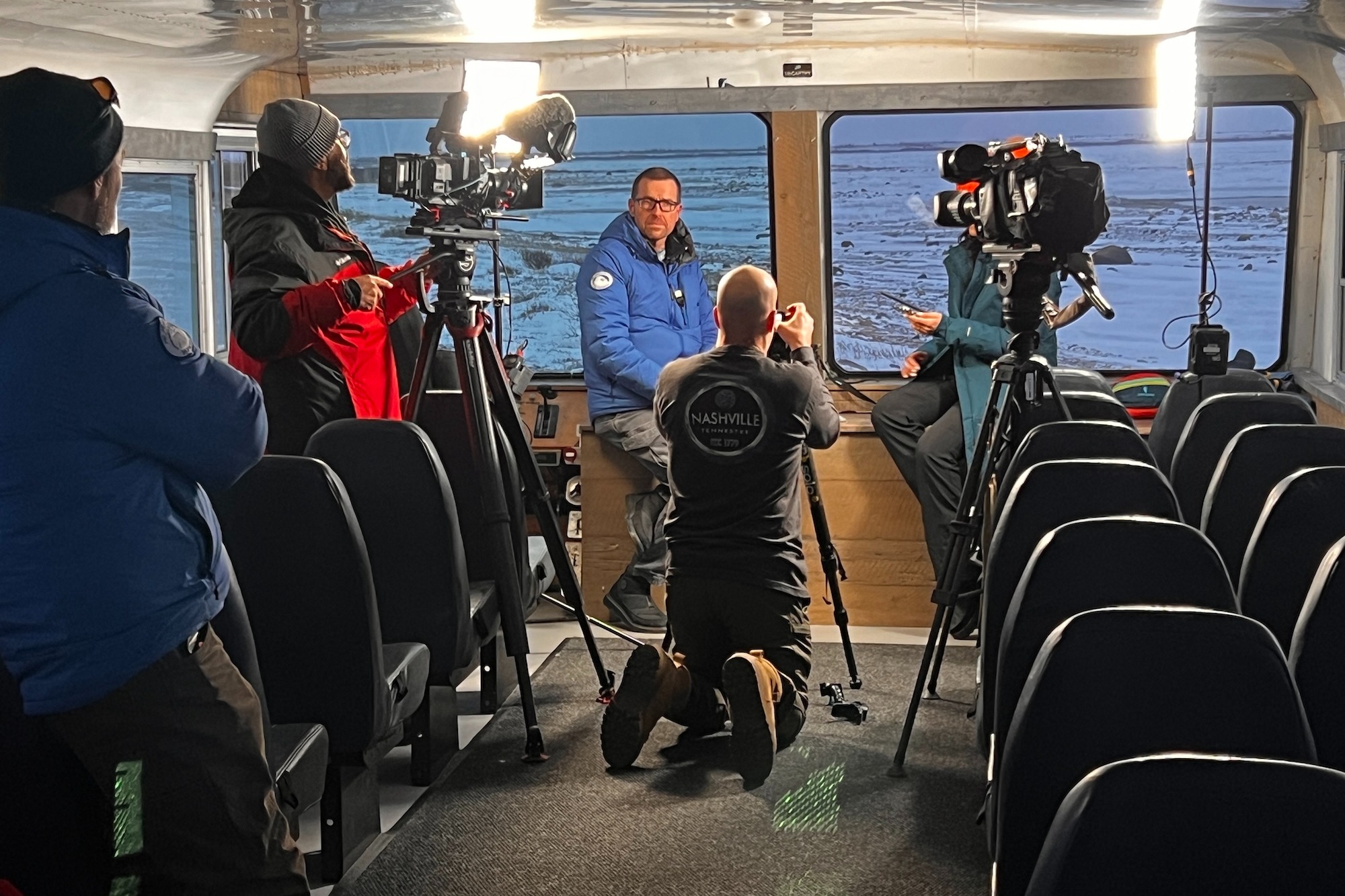 Geoff York Speaks with a Media News Crew on a Tundra Buggy