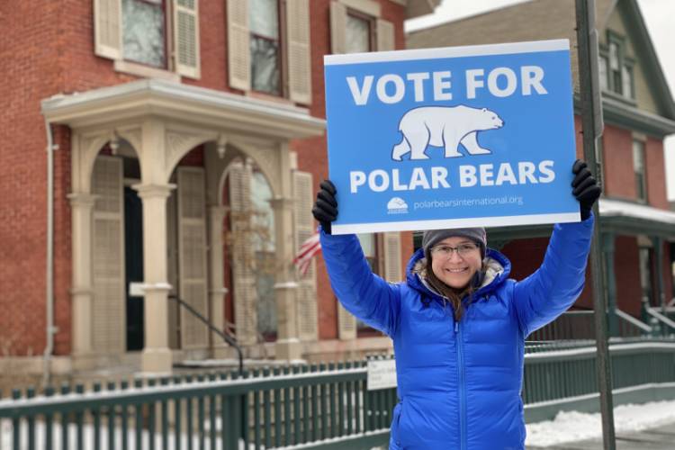 Marissa Krouse with a Vote for Polar Bears sign
