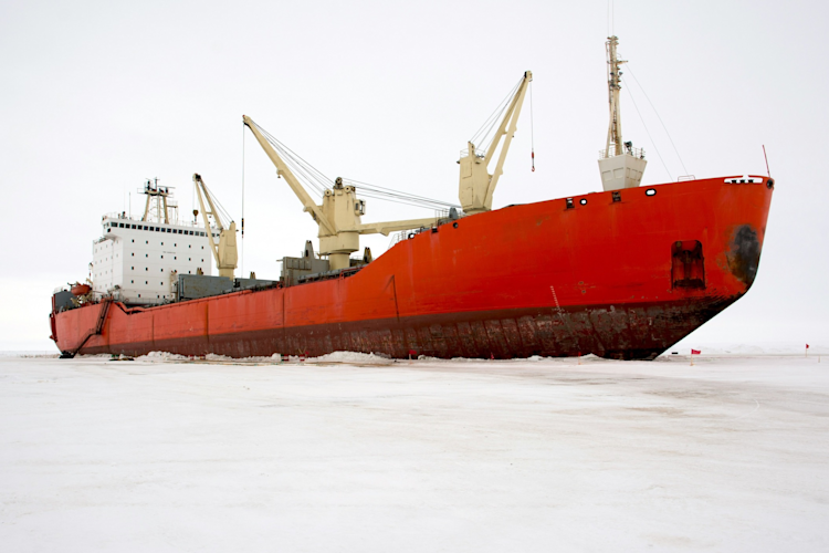 Commercial ship traveling through Arctic sea ice