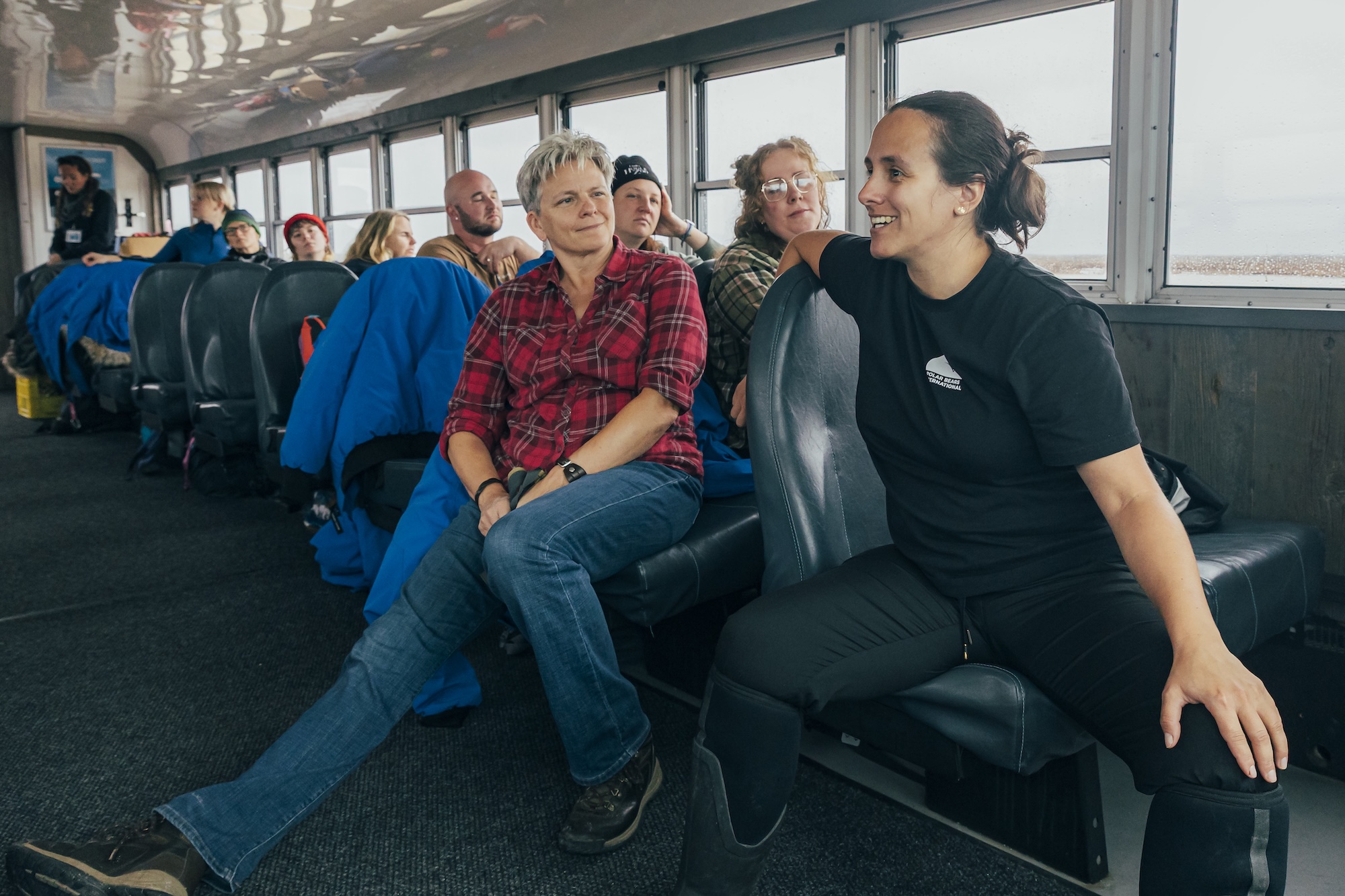 Chloé Warret Rodrigues talks to guests on a tundra buggy as a PBI field ambassador