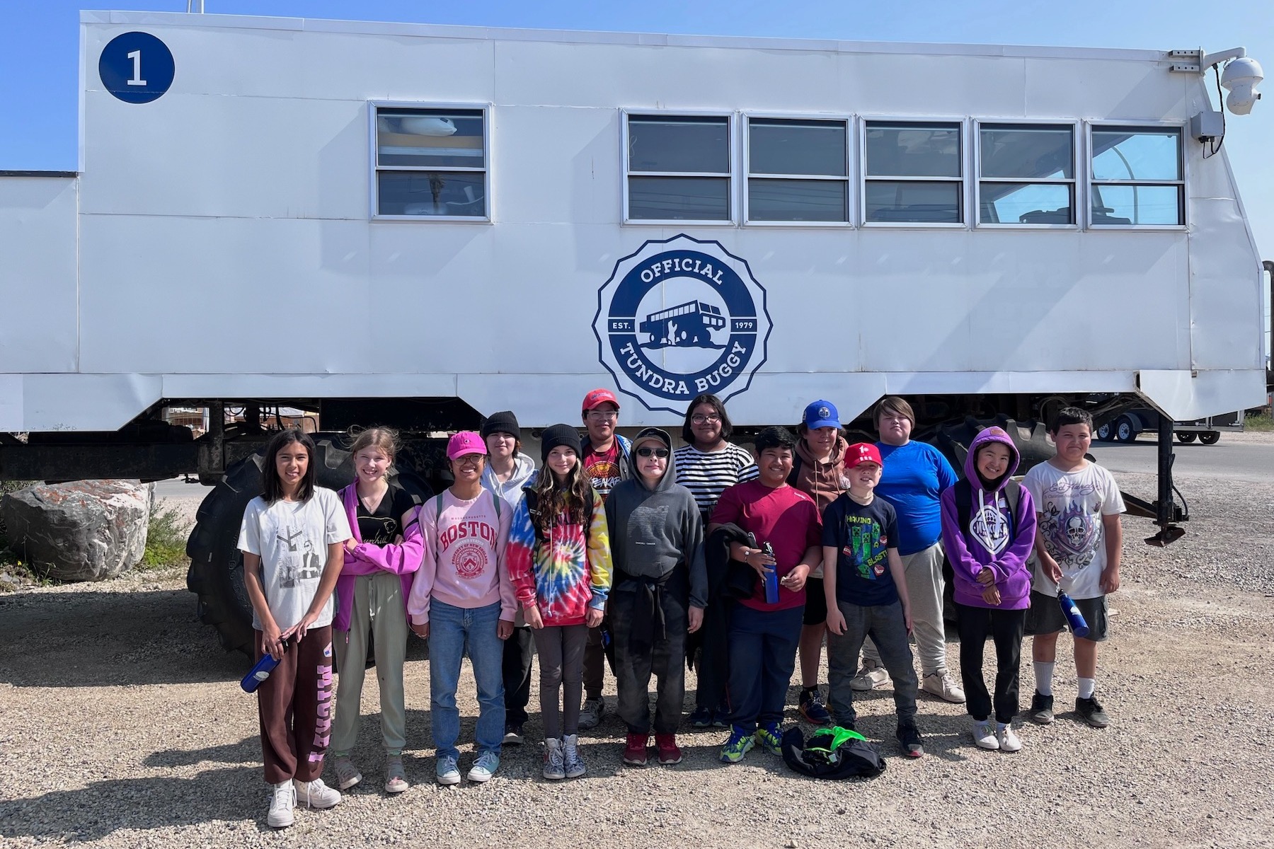 Kids Summer Camp in front of a Tundra Buggy