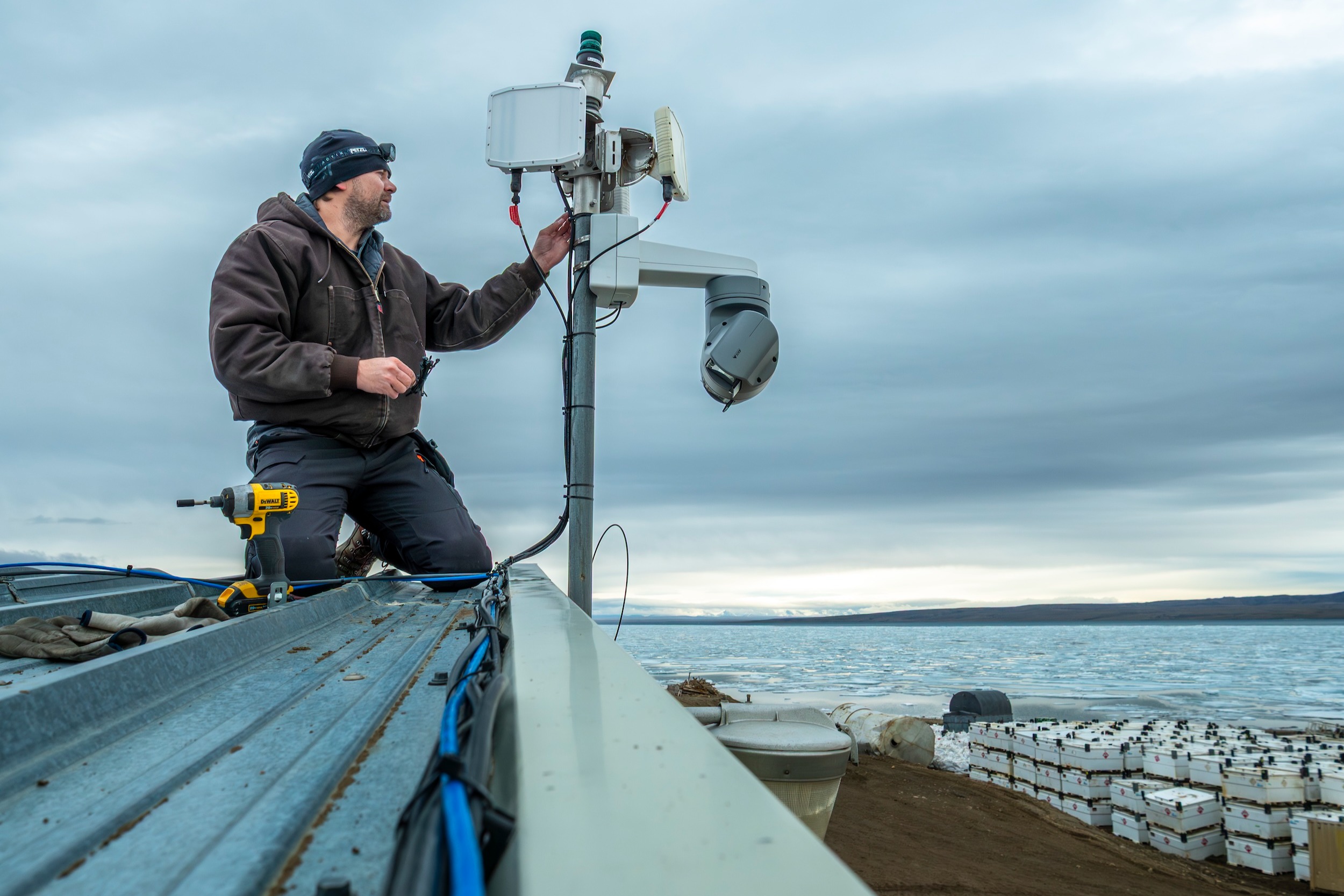 Kieran McIver setting up the bear-dar at a weather station in Eureka, Canada