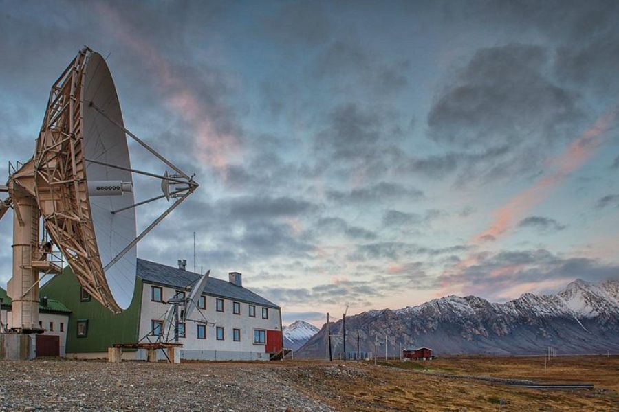 Isfjord Radio Hotel during sunset.