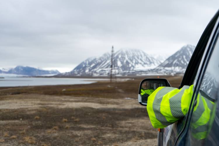 One of the watchmen looks out at Prins Heinrich, where a bear was eating a freshly hunted harbor seal