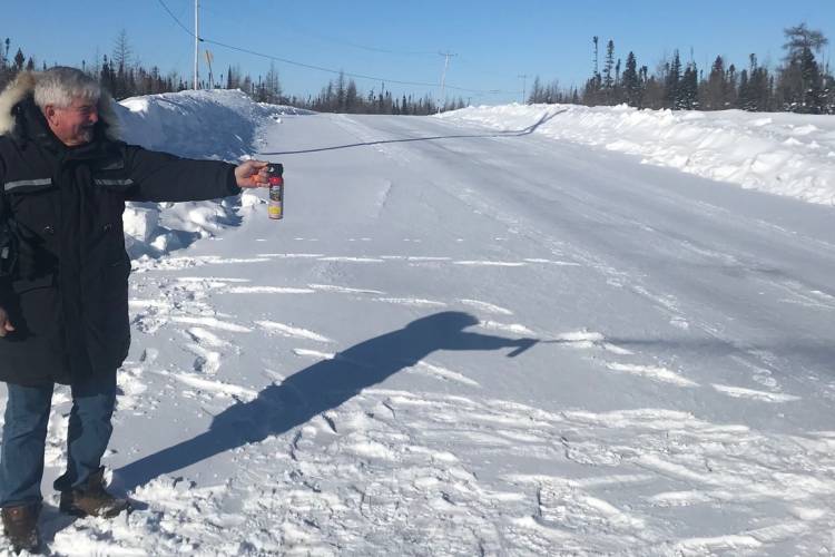 Polar Bears International representative Clive Tesar tries out the effectiveness of bear spray at -36c. There were no bears around at the time, this was just a test canister. 