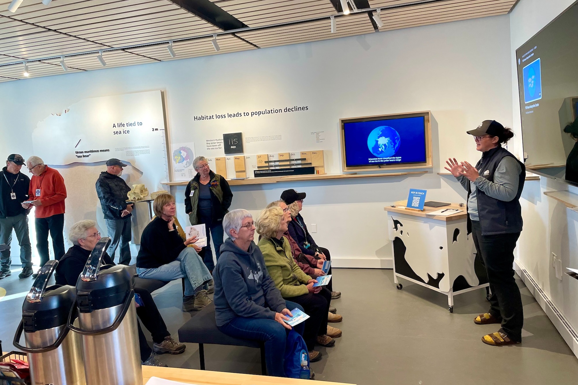 Kayla McCurry giving a presentation in the Polar Bears International House