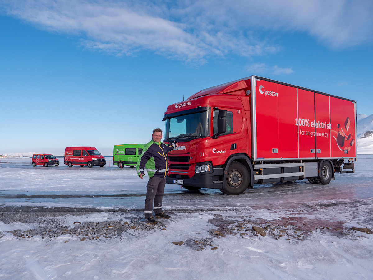 Olaf Ervik of Bring Cargo Svalbard AS, in front of his fleet of electric delivery vehicles