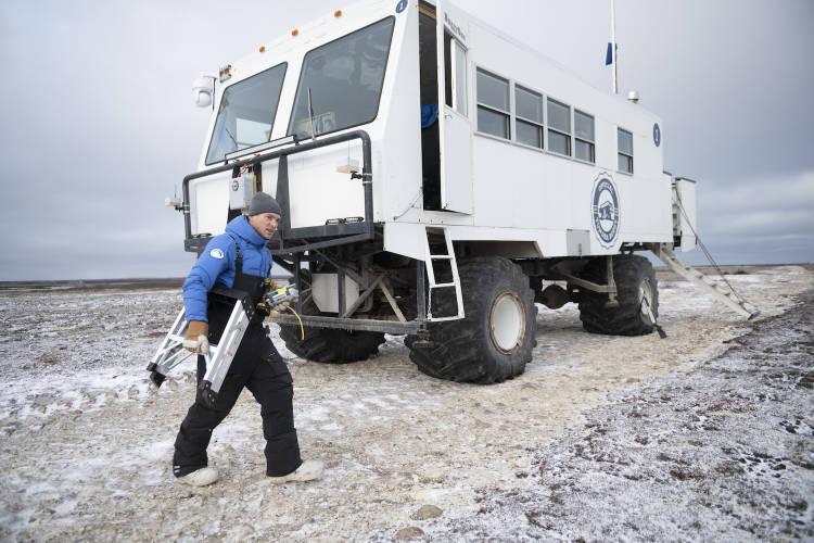 Polar Bears International's BJ Kirschhoffer works on Tundra Buggy One