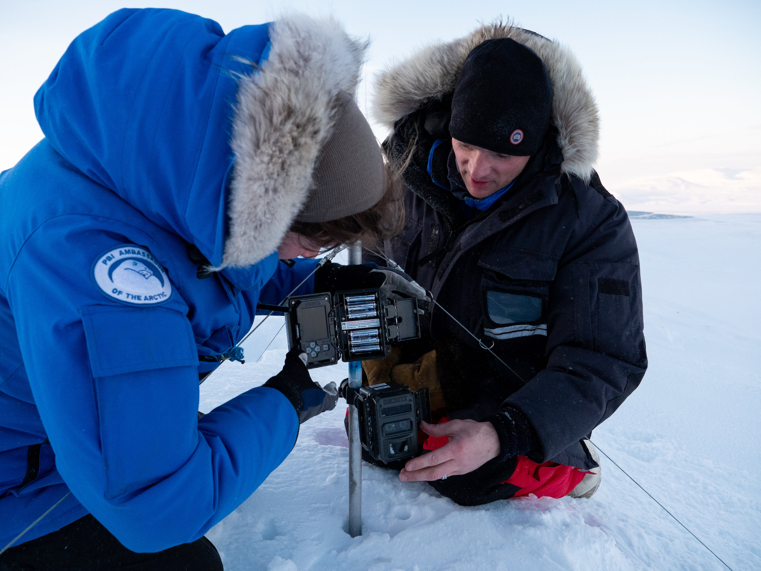 BJ Kirschhoffer and Joanna Suhlich set up a remote camera for Polar Bears International's maternal den study