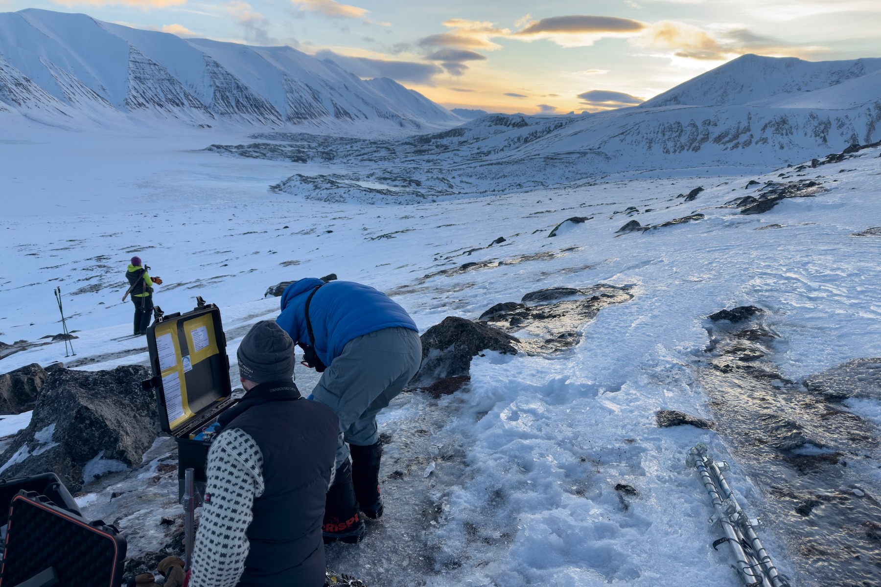 Researchers set up the den cams outside hidden polar bear dens