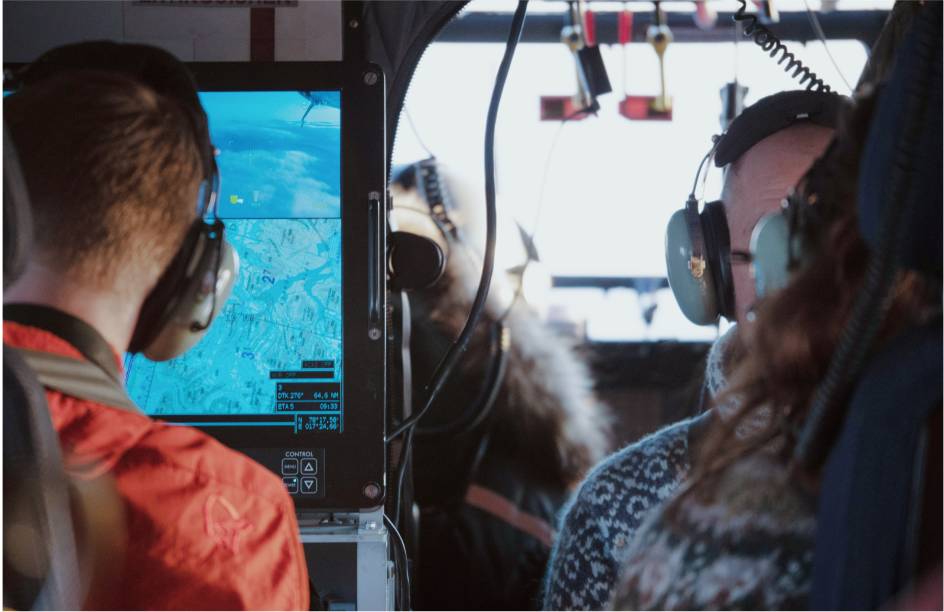 Researchers inside a helicopter