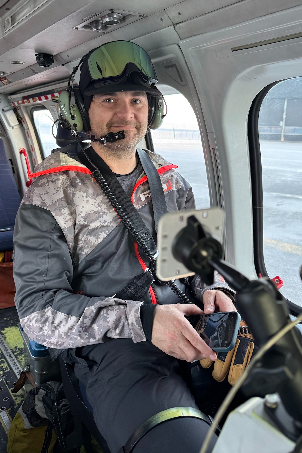 Kieran McIver in the helicopter in Svalbard