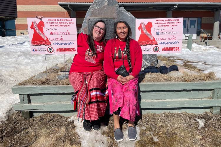 Georgina Berg and Katie de Muelles with Missing and Murdered Indigenous Women, Girls, and 2SLGBTQQIA+ signs