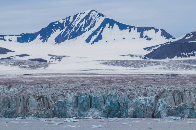 A glacier at the base of the mountains in Svalbard