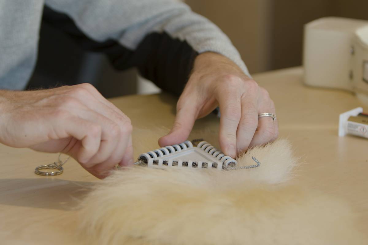 A burr on fur tracker is attached to a model piece of polar bear fur