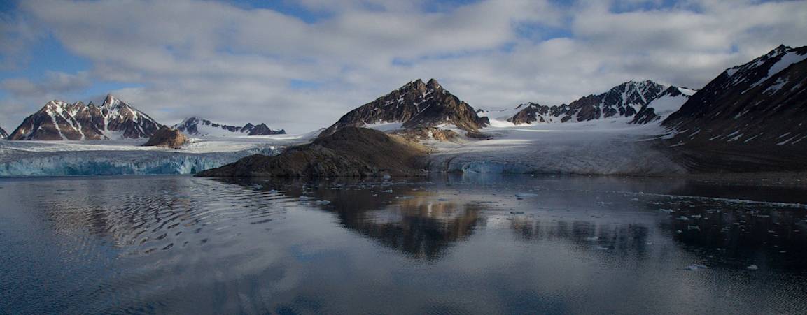 Svalbard landscape with mountains and glaciers, taken from the water during summer