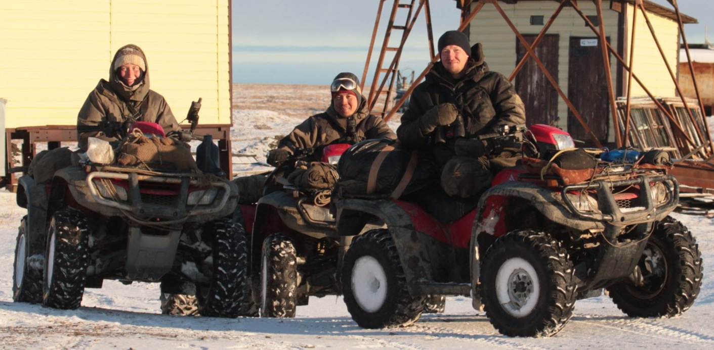 The polar bear research team prepares to head out on ATVs.