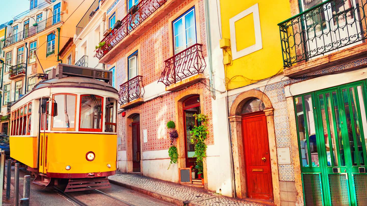Yellow tram on a road in Lisbon, Portugal